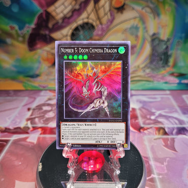 A Super Rare "Number 5: Doom Chimera Dragon" card from the Yugioh Set: Dark Neostorm. 