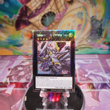 A Platinum Secret Rare "Number C39: Utopia Ray" card from the Yugioh Set: Quarter Century Stampede (RA04).