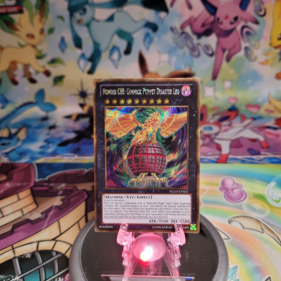 A Gold Secret Rare "Number C88: Gimmick Puppet Disaster Leo" card from the Yugioh Set: Premium Gold (PGLD).