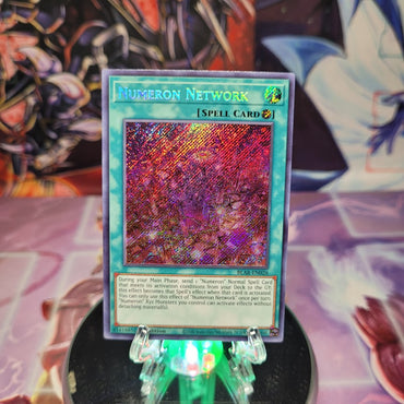 A Secret Rare "Numeron Network" card from the Yugioh Set: Battles of Legend: Armageddon.