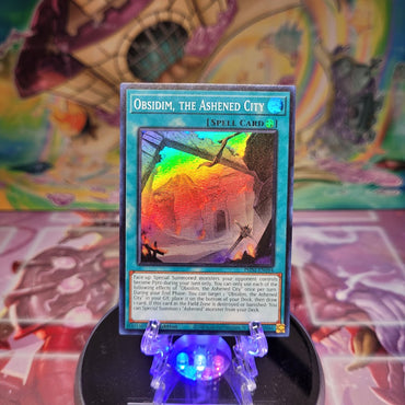 A Super Rare "Obsidim, the Ashened City" card from the Yugioh Set: Phantom Nightmare (PHNI).