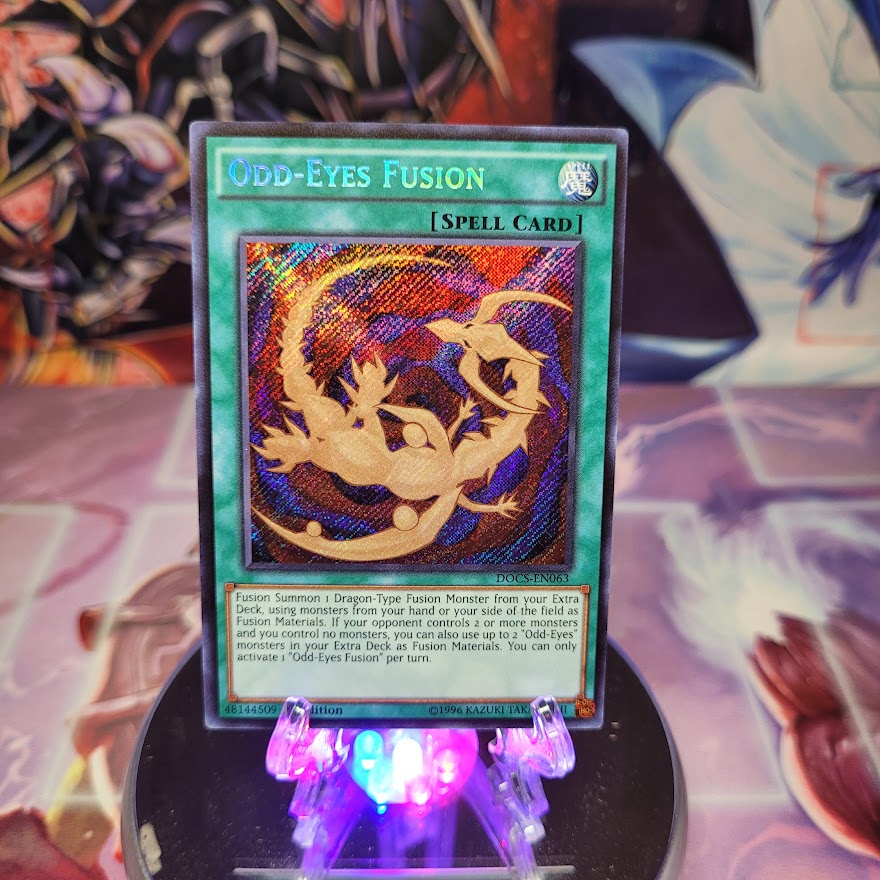  A Secret Rare "Odd-Eyes Fusion" card from the Yugioh Set: Dimension of Chaos (DOCS).