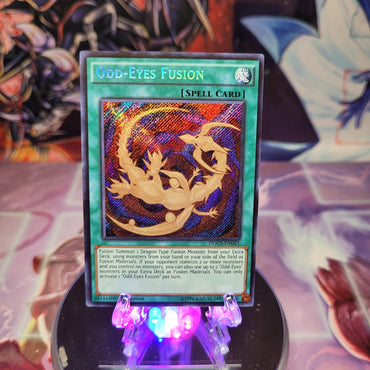  A Secret Rare "Odd-Eyes Fusion" card from the Yugioh Set: Dimension of Chaos.