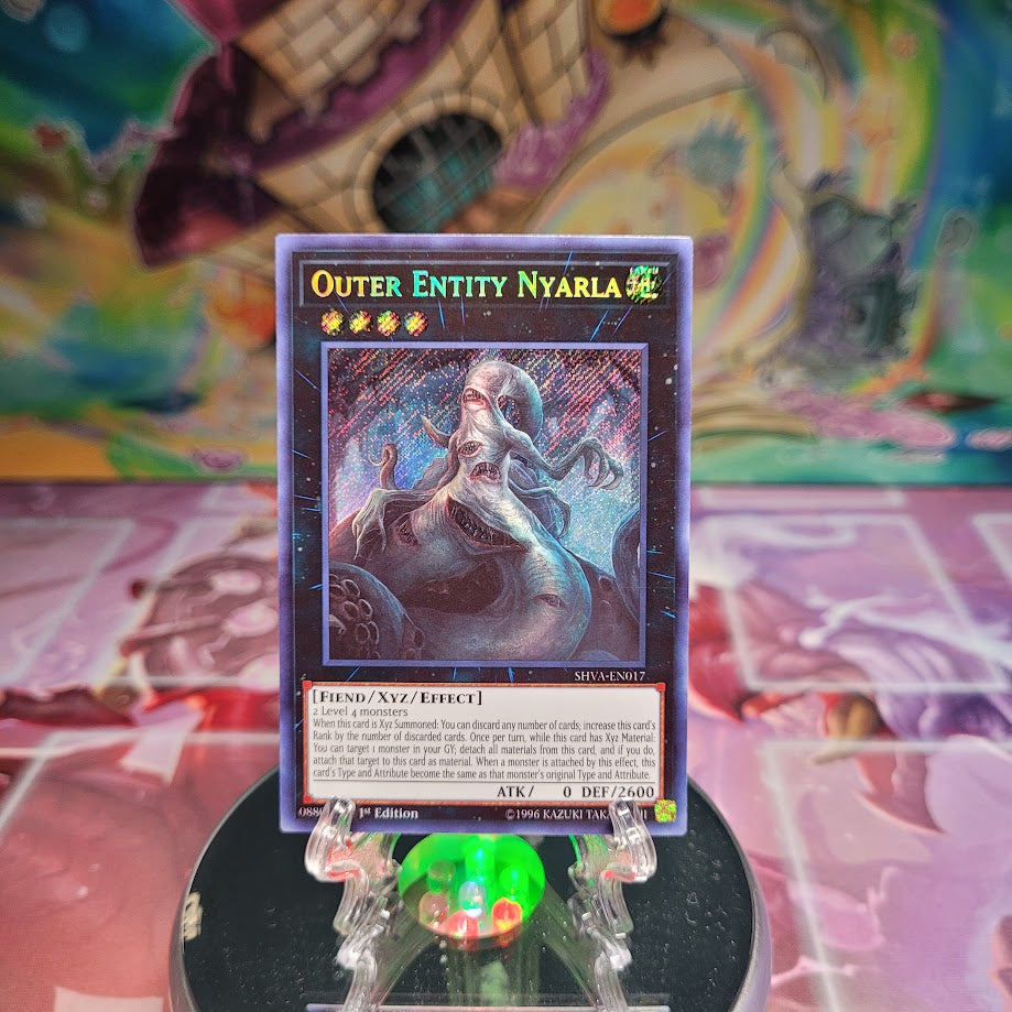 A Secret Rare "Outer Entity Nyarla" card from the Yugioh Set: Shadows in Valhalla.