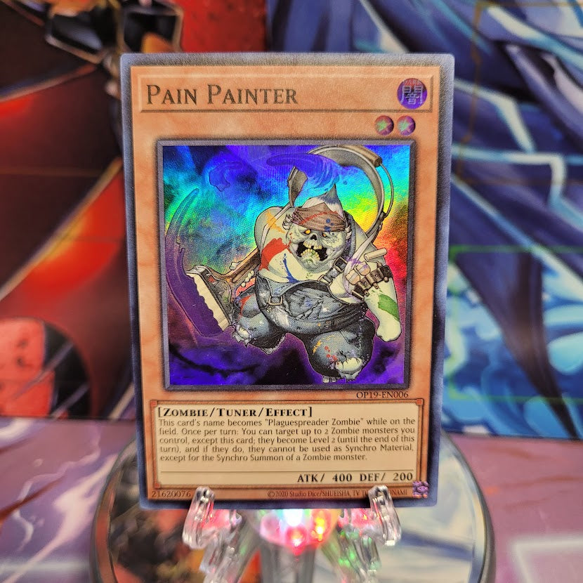 A Super Rare "Pain Painter" card from the Yugioh OTS Tournament Pack 19 set.