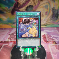 A Secret Rare "Painful Decision" card from the Yugioh Set: Dimension of Chaos.