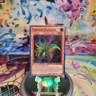 A Super Rare "Parasite Paracide" card from the Yugioh Set: Pharaoh's Servant 25th Anniversary Edition (PSV).