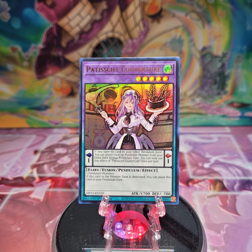 An Ultra Rare "Patissciel Couverture" card from the Yugioh Dueling Heroes Mega-Tin Mega Pack.