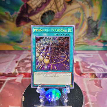 A Secret Rare "Pendulum Paradox" card from the Yugioh 2018 Mega-Tins Mega Pack.