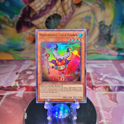 An Ultra Rare "Performage Trick Clown" card from the Yugioh Set: Battles of Legend: Relentless Revenge. 