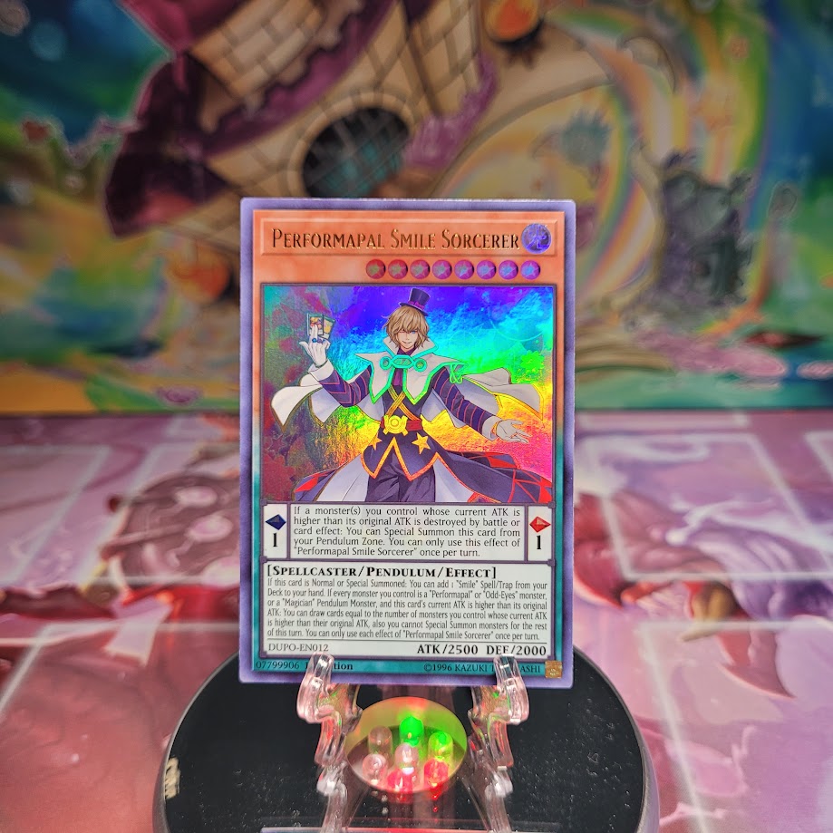 An Ultra Rare "Performapal Smile Sorcerer" card from the Yugioh Set: Duel Power.