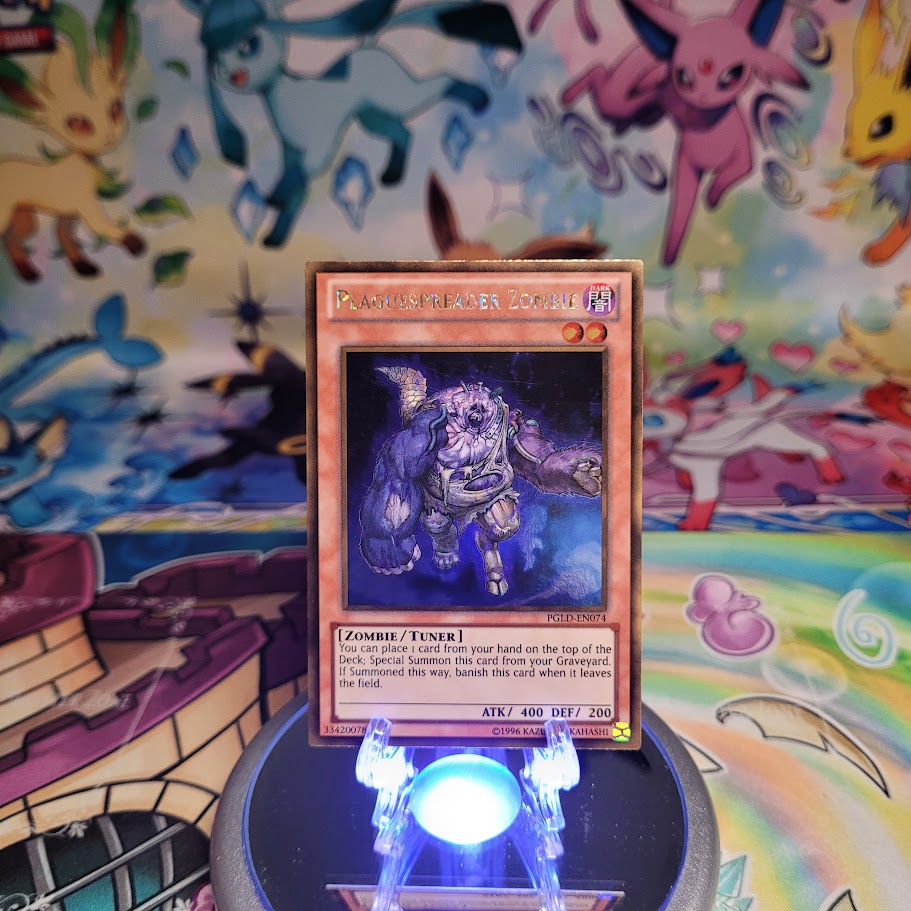 A Gold Rare "Plaguespreader Zombie" card from the Yugioh Set: Premium Gold (PGLD).