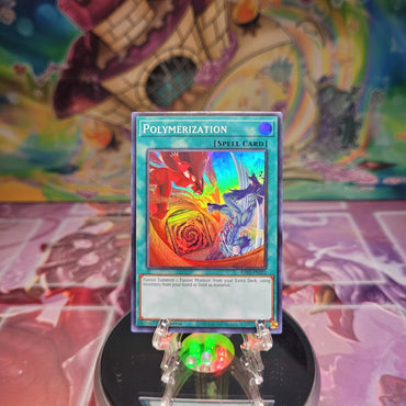 A Super Rare Alternate Art "Polymerization" card from the Yugioh Set: Quarter Century Bonanza (RA03).