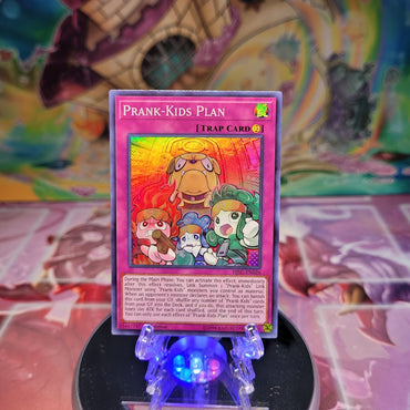 A Super Rare "Prank-Kids Plan" card from the Yugioh Set: Hidden Summoners.