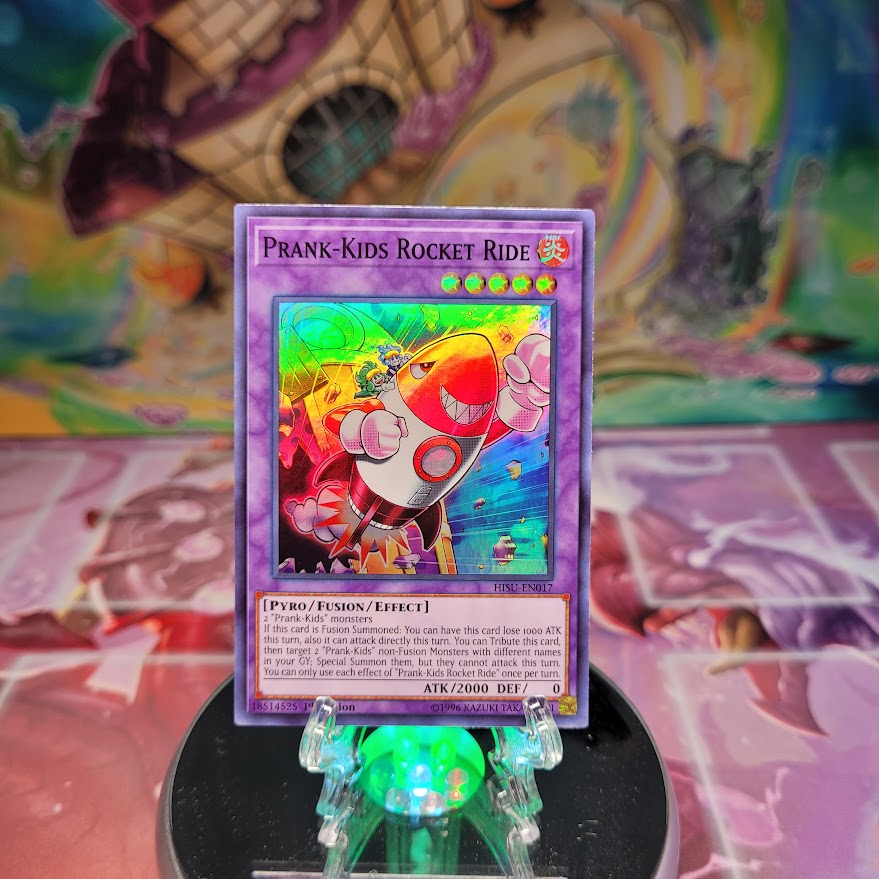 A Super Rare "Prank-Kids Rocket Ride" card from the Yugioh Set: Hidden Summoners. 