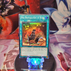 A Super Rare "Pre-Preparation of Rites" card from the Yugioh Set: Rarity Collection 1 (RA01).