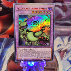 An Ultra Rare Red "Predaplant Chimerafflesia" card from the Yugioh Set: Legendary Duelists: Season 3.