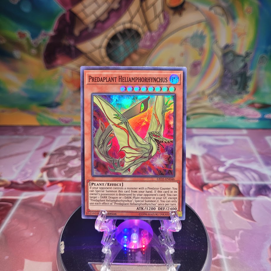 A Super Rare "Predaplant Heliamphorhynchus" card from the Yugioh Set: Legendary Duelist: Immortal Destiny.