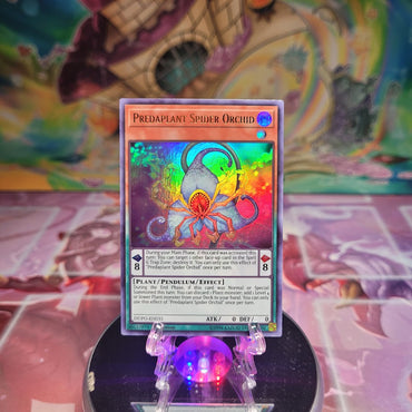 An Ultra Rare "Predaplant Spider Orchid" card from the Yugioh Set: Duel Power.