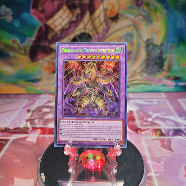 A Secret Rare "Predaplant Triphyoverutum" card from the Yugioh Set: Legendary Duelists: Season 3 (LDS3).