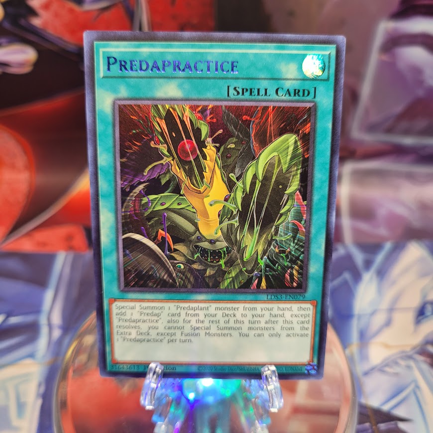An Ultra Rare Blue "Predapractice" card from the Yugioh Set: Legendary Duelist: Season 3 (LDS3).