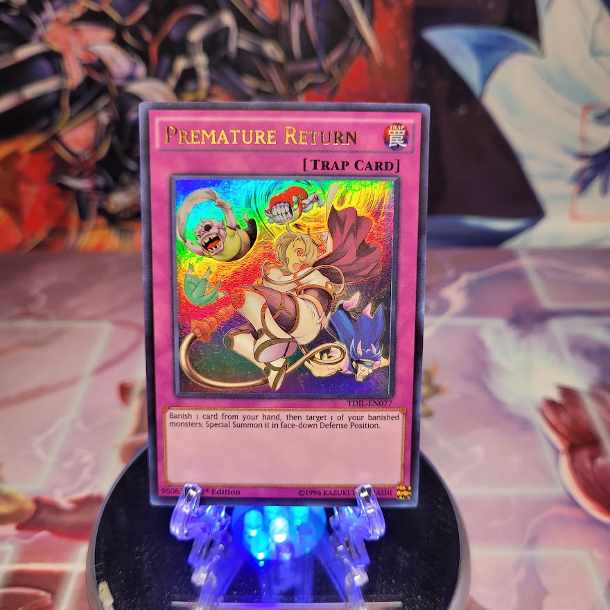 An Ultra Rare "Premature Return" card from the Yugioh Set: The Dark Illusion (TDIL).