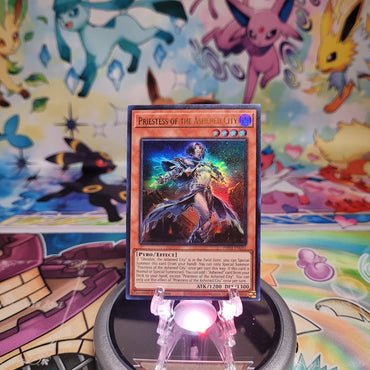 An Ultra Rare "Priestess of the Ashened City" card from the Yugioh Set: Phantom Nightmare (PHNI).