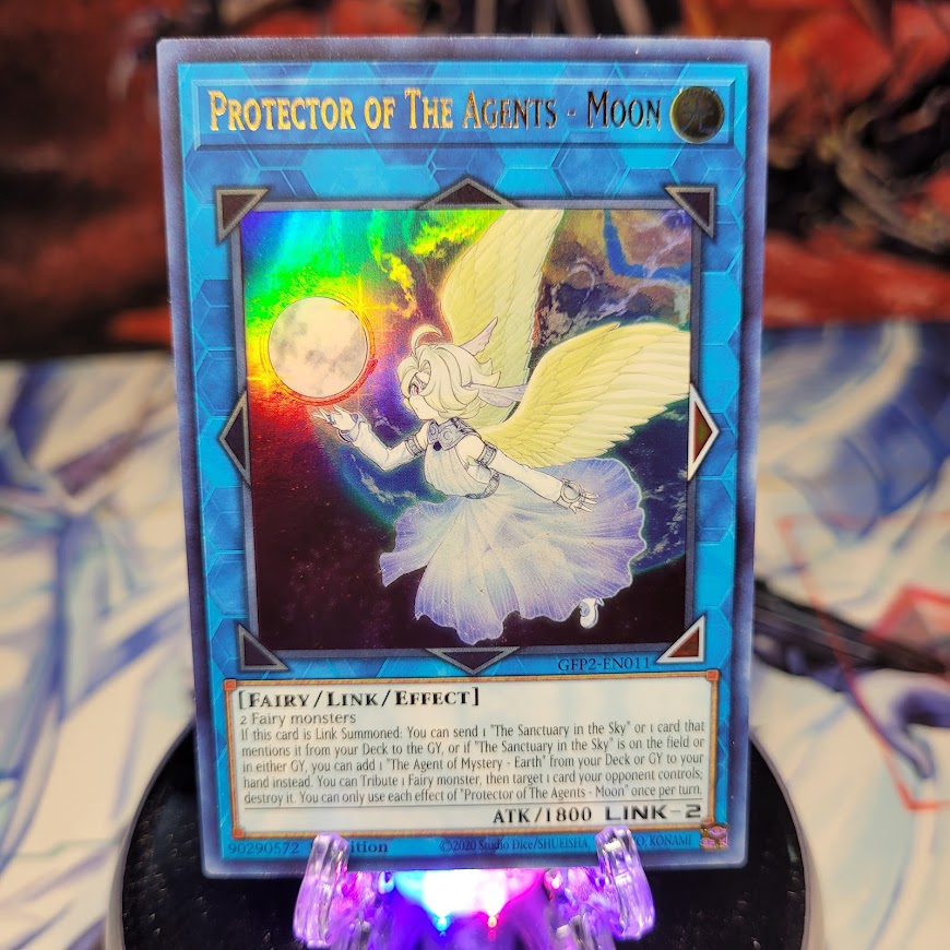  An Ultra Rare "Protector of the Agents - Moon" card from the Yugioh Set: Ghosts From the Past: The 2nd Haunting (GFP2).