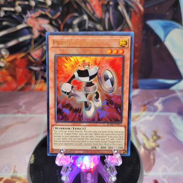 An Ultra Rare "Puppet Pawn" card from the Yugioh Set: Battles of Legend: Monstrous Revenge.