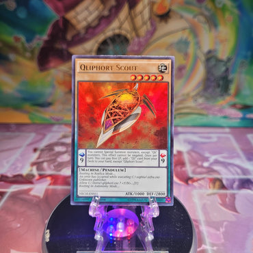 An Ultra Rare "Qliphort Scout" card from the Yugioh Set: The New Challengers.