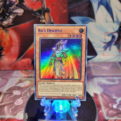 An Ultra Rare Blue "Ra's Disciple" card from the Yugioh Set: Dragons of Legend: The Complete Series (DLCS).