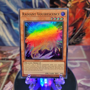 A Super Rare "Radiant Vouirescence" card from the Yugioh 2022 Tin of the Pharaoh's Gods Set.