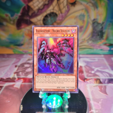 A Super Rare "Raidraptor - Necro Vulture" card from the Yugioh Set: Wing Raiders.