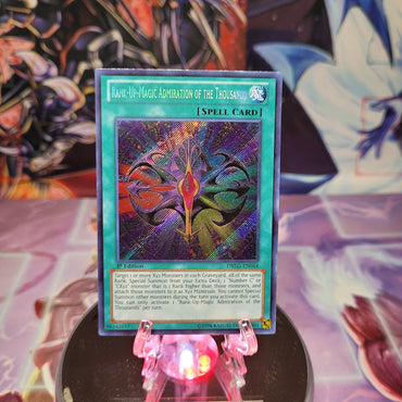  A Secret Rare "Rank-Up-Magic Admiration of the Thousands" card from the Yugioh Set: Dragons of Legend.