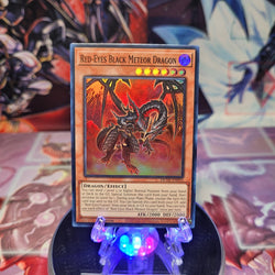 A Super Rare "Red-Eyes Black Meteor Dragon" card from the Yugioh Set: Duelist Nexus.