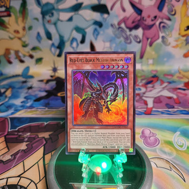 An Ultra Rare "Red-Eyes Black Meteor Dragon" card from the Yugioh Set: Magnificent Monsters (MAMO).