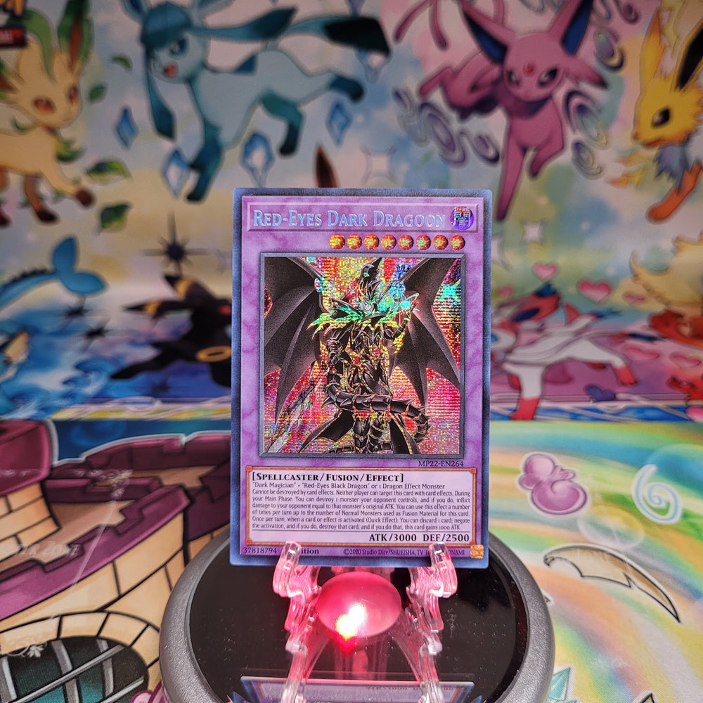 A Prismatic Secret Rare "Red-Eyes Dark Dragoon" card from the Yugioh 2022 Tin of the Pharaoh's Gods set (MP22).