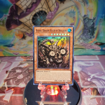 A Super Rare "Redox, Dragon Ruler of Boulders" card from the Yugioh Set: Quarter Century Bonanza (RA03).