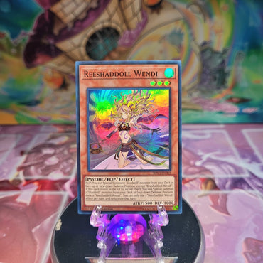 A Super Rare "Reeshaddoll Wendi" card from the Yugioh Structure Deck: Shaddoll Showdown.