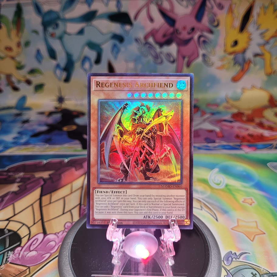 An Ultra Rare "Regenesis Archfiend" card from the Yugioh Set: Magnificent Monsters (MAMO).