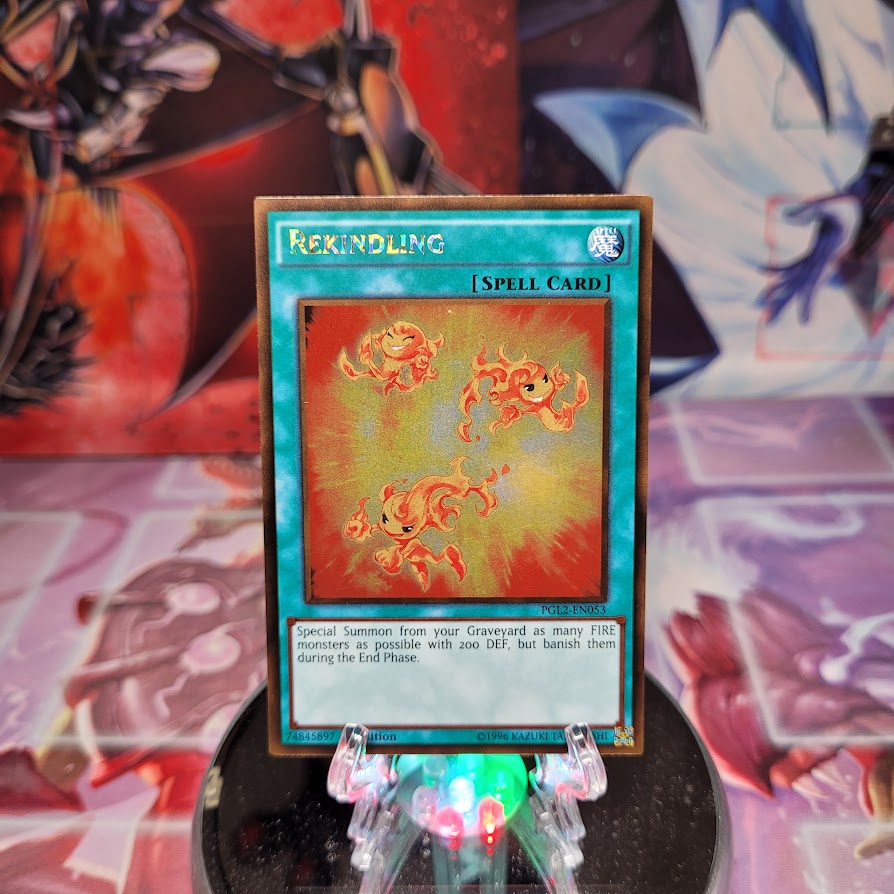 A Gold Rare "Rekindling" card from the Yugioh Set: Premium Gold: Return of the Bling (PGL2).