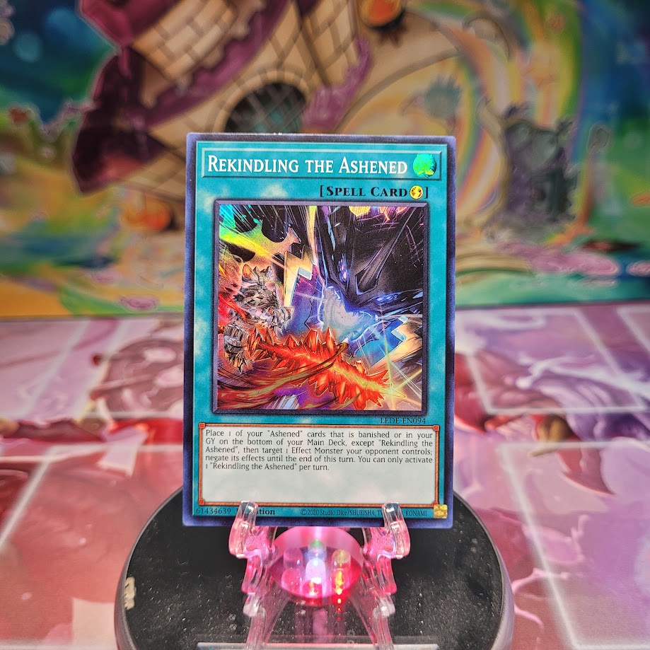 A Super Rare "Rekindling the Ashened" card from the Yugioh Set: Legacy of Destruction.