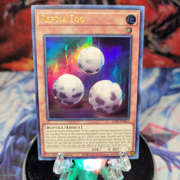  An Ultra Rare "Reptia Egg" card from the Yugioh Set: Ghosts From the Past: The 2nd Haunting (GFP2).