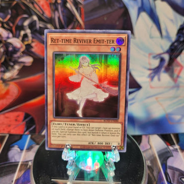 A Super Rare "Ret-Time Reviver Emit-Ter" card from the Yugioh Set: Rise of the Duelist.