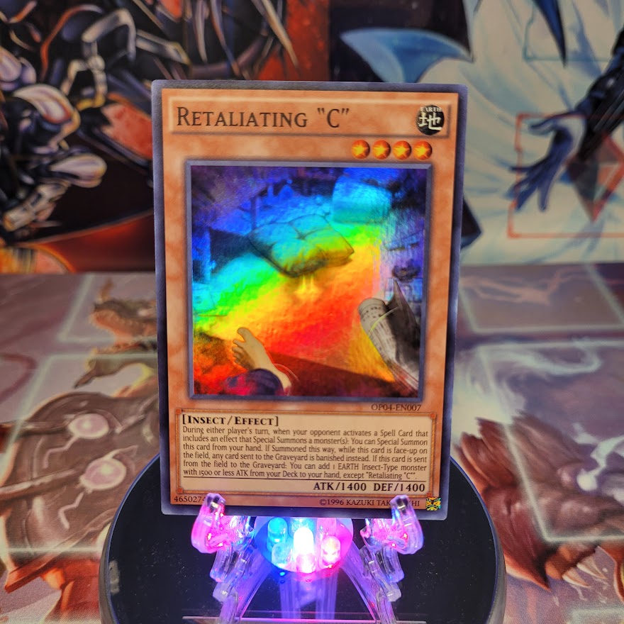  A Super Rare "Retaliating "C"" card from the Yugioh Set: The Infinity Chasers.