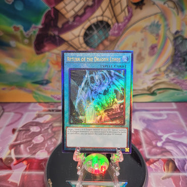 A Prismatic Ultimate Rare "Return of the Dragon Lords" card from the Yugioh Set: Quarter Century Bonanza (RA03).