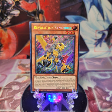 A Secret Rare "Revolution Synchron" card from the Yugioh Set: Duelist Nexus (DUNE).