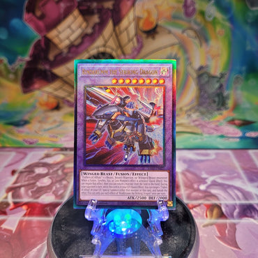 A Prismatic Ultimate Rare "Rindbrumm the Striking Dragon" card from the Yugioh Set: Rarity Collection 2 (RA02).