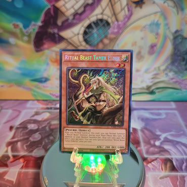  A Secret Rare "Ritual Beast Tamer Elder" card from the Yugioh Set: Quarter Century Bonanza (RA03).