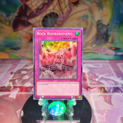 A Super Rare "Rock Bombardment" card from the Yugioh Set: Secret Slayers.